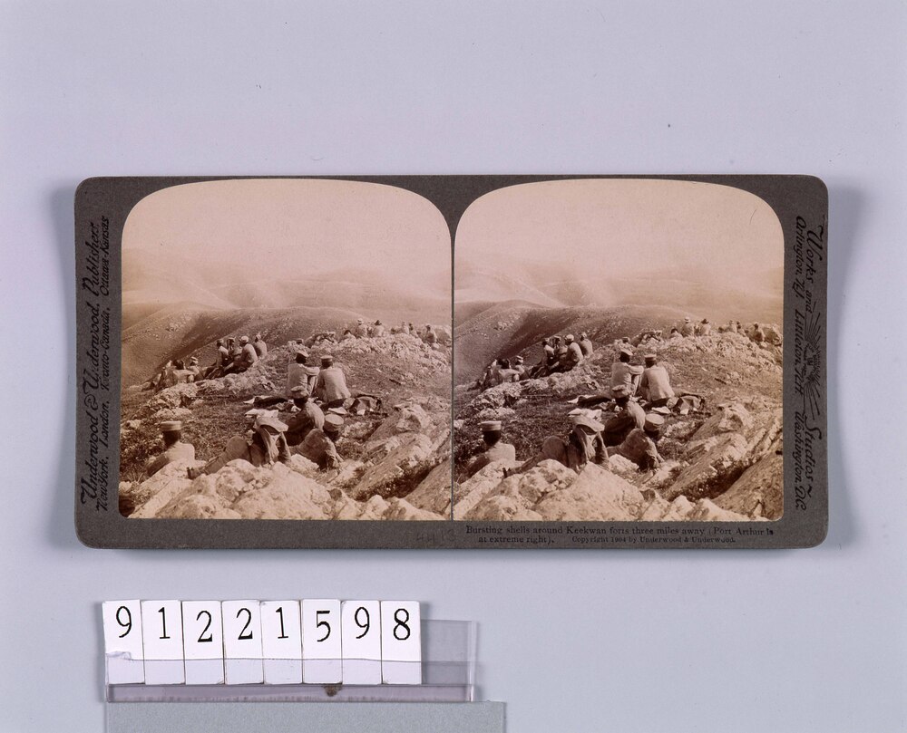 Bursting shellsAround Keekwan forts three milesAway(PortArthur isAt extremr extreme right).